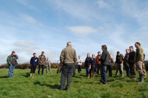 Farmers discussing reducing farm emissions. Photo credit FCCT