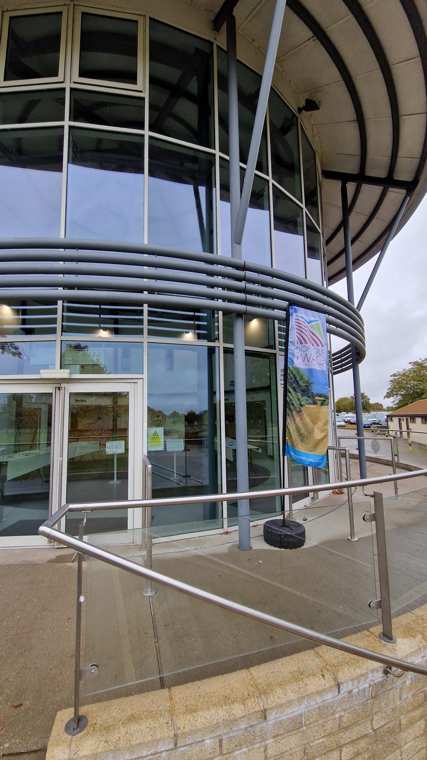The entrance to a building with Norfolk FWAG banner