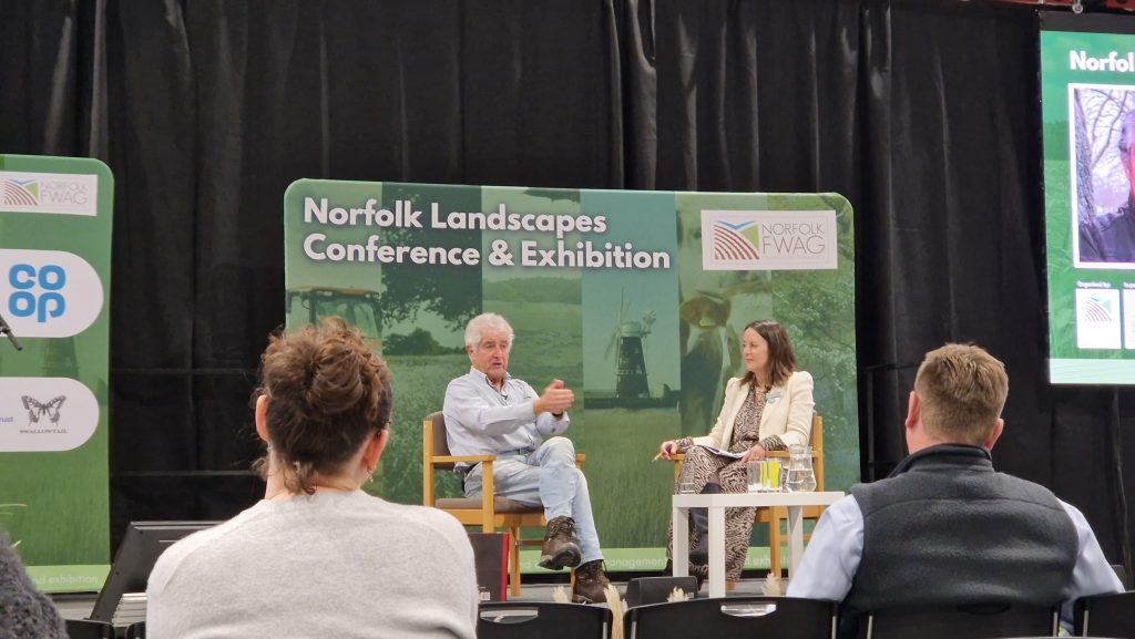 Tony Juniper and Emily Norton sitting on stage at the Norfolk FWAG conference
