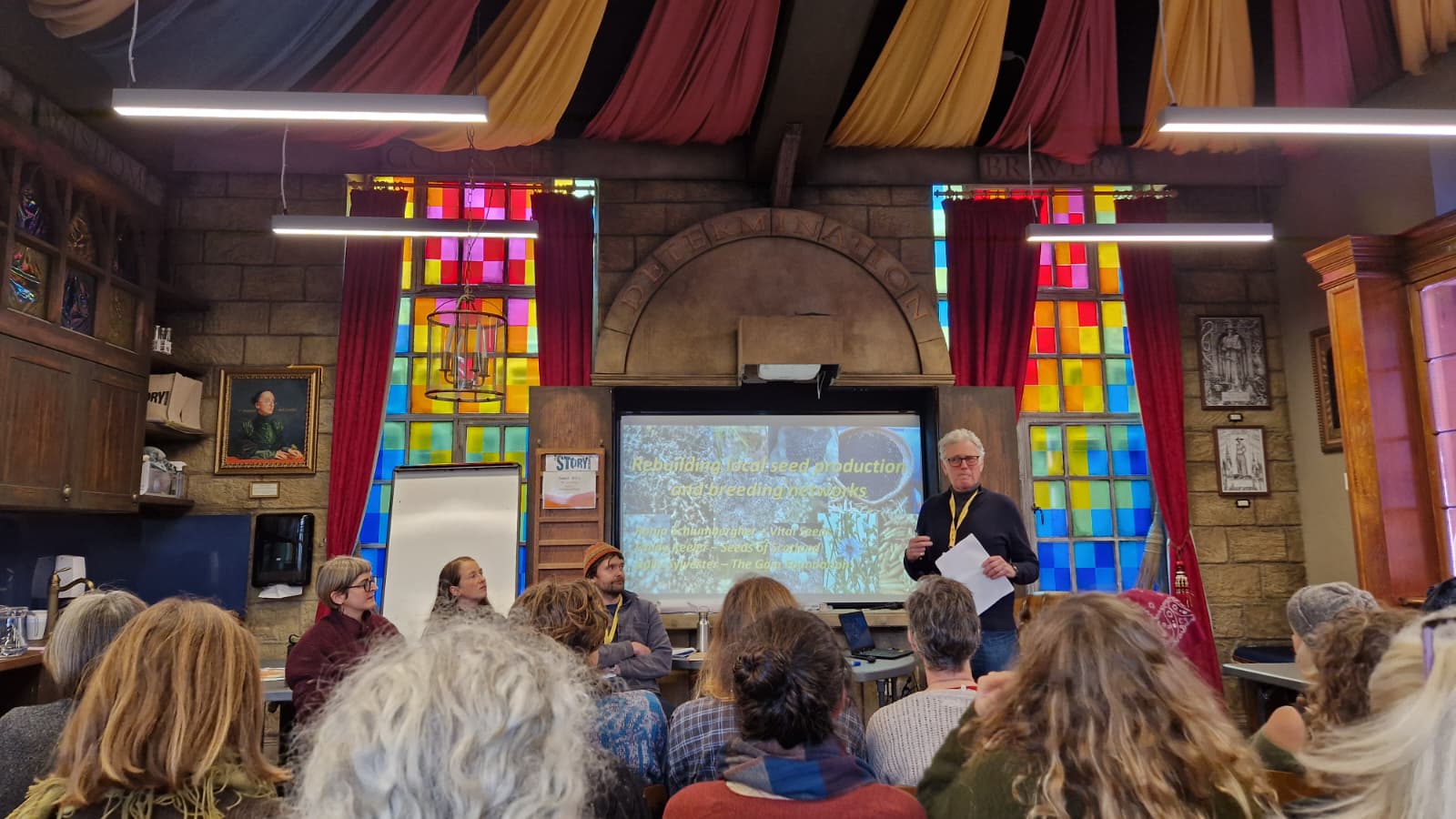 A man speaking to an audience at The Story Museum in Oxford